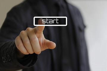 Businessman clicks on the start button