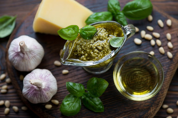 Close-up of basil pesto with its cooking ingredients
