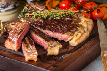 Beef steaks with grilled vegetables and seasoning 