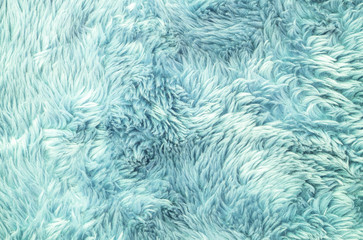 Closeup surface abstract fabric pattern at the light blue fabric carpet at the floor of house texture background