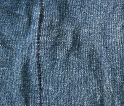 blue denim close-up and a vertical seam