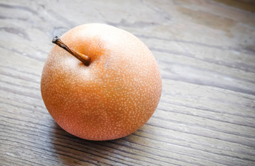 Asian pear on the wooden background
