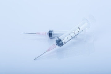 syringes isolated on blue background
