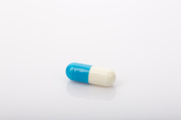 white and blue capsule,medical concept