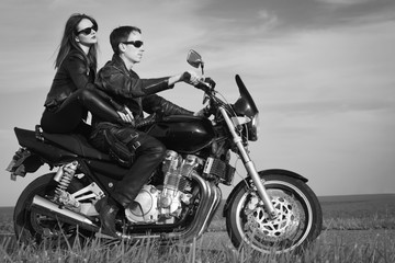 Obraz na płótnie Canvas Active couple riding on the motorbike