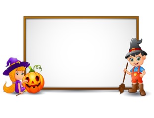 Halloween sign with witch, boy, and pumpkin