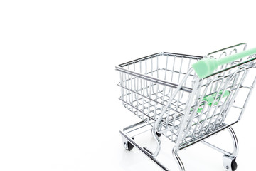 Empty shopping cart, on white background with copy-space