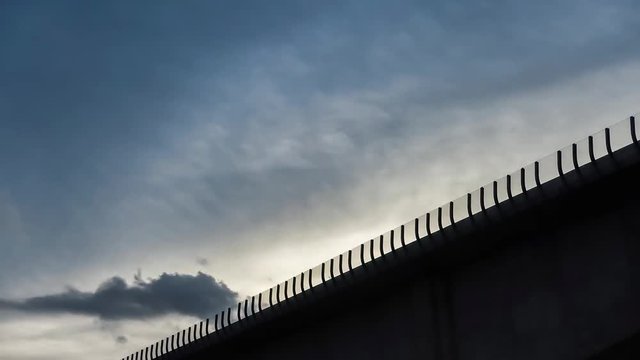 Time lapse of clouds and blue sky and bridge for background, 4K or UHD Resolution.