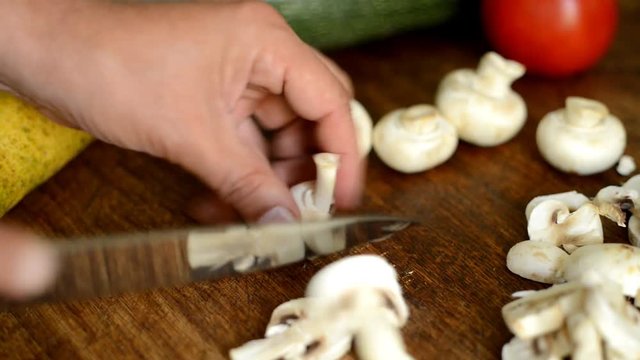 preparing champignons for a vegetarian dish