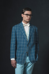 Obraz premium Retro 1920s dandy man wearing blue checkered jacket and pants.