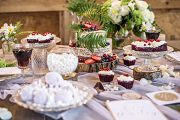 Barn wedding, the design and decoration Candy bar table and honeymooners. Rustic.