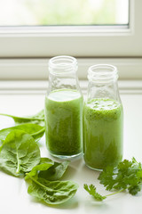 healthy green spinach smoothie with cilantro lime banana ginger