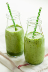 healthy green spinach smoothie with cilantro lime banana ginger