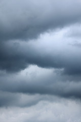 Blue sky with storm cloud .