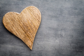 Two vintage hearts on gray metal background.