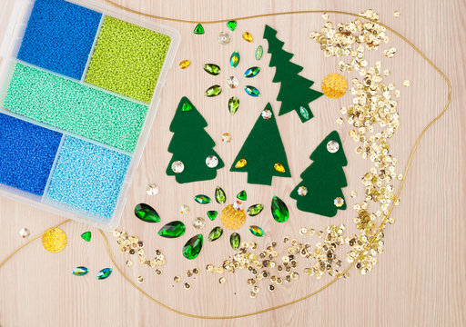Christmas card. Beads, christmas tree made of felt and decorative stones. Hand Made Accessories.