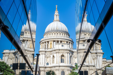 Fototapeta premium St Pauls Cathedral and its reflection from glass walls of One New Change building in London