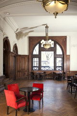 Red Chairs In Empty Restaurant