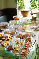 Breakfast buffet with delicious cakes and bread