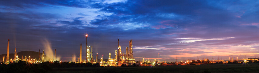 Fototapeta na wymiar oil refinery with sunrise or twilight in panorama.