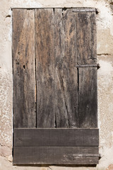 Old wooden door damaged by years