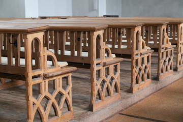 Closeup of wooden benches in church