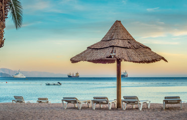 Relaxing facilities on the public beach of Eilat - famous resort city in Israel