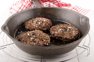 aberdeen angus burger in a pan