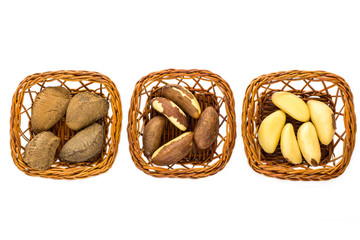 Brazil Nuts in baskets over white background.