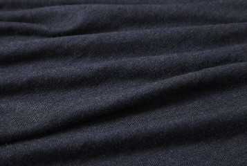 Fototapeta premium A full page of black fine knitted material texture