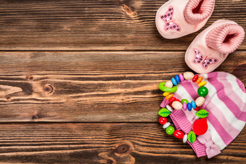 Baby clothes on wooden background