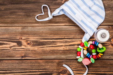 Baby clothes on wooden background