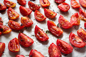 Sun dried tomatoes on white baking paper