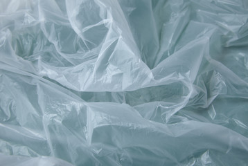 A full page of white polythene bag texture on a green background