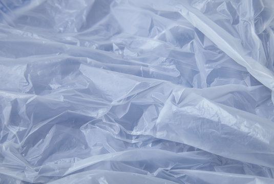 A full page of white carrier bag texture on a blue background