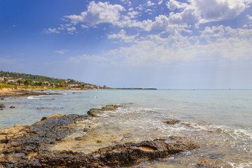Fototapeta na wymiar Salento coast, Ionian sea:panoramic view of Torre Vado town.Italy (Apulia).In the background the beach and the tourist port with the watchtower.