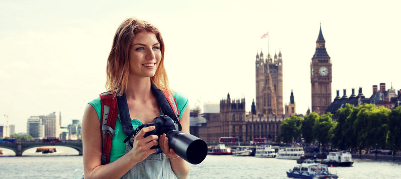 woman with backpack and camera over london big ben