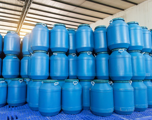 Blue Plastic barrels contain