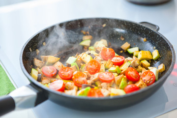 Vegetable ragout in pan, on stove