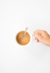 Hand holding a mug isolated