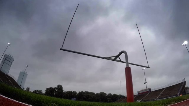 Time-lapse of football stadium goalpost as a storm rolls in, 4K