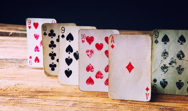 Playing cards on wooden table