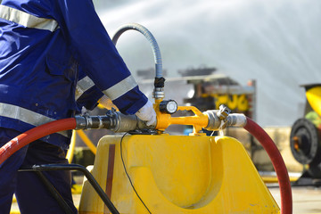 Obraz premium Fire fighting by foam , Fireman in action activated foam.