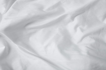 A full page of soft white creased duvet texture