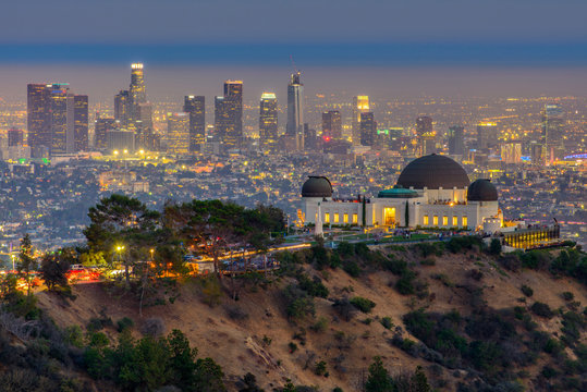 The Griffith Observatory and Los Angeles city skyline at twilight time - Powered by Adobe