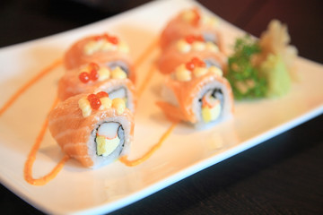 salmon sushi rolls and spicy sauce