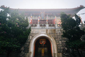 Historic building in fog, at Ngong Ping, Lantau Island, Hong Kon