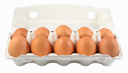 Carton of fresh brown eggs on a white