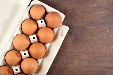 Carton of fresh brown eggs