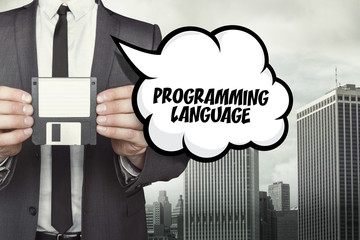 Programming language text on speech bubble with businessman